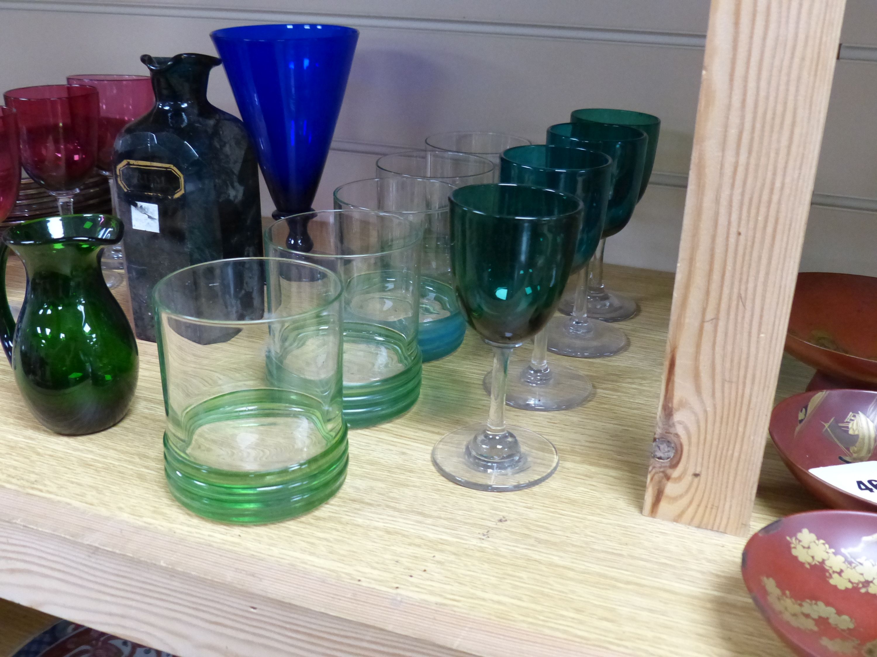 A quantity of mixed coloured glass and paper weights